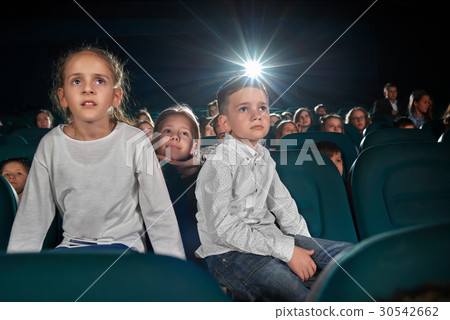 Children watching movies at the cinema Children watching movies at the cinema 30542662