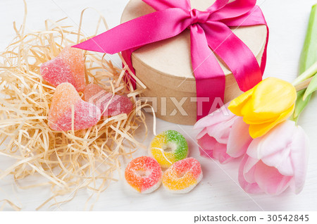Pink yellow tulips and gift box with red ribbon 30542845