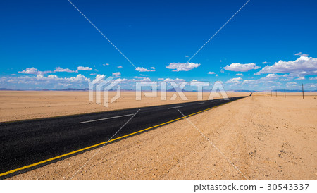 vibrant image of highway and blue cloudy sky vibrant image of highway and blue cloudy sky 30543337
