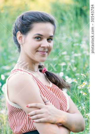 Portrait of girl in a chamomile field Portrait of girl in a chamomile field 30543784