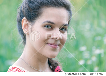 Portrait of girl in a chamomile field Portrait of girl in a chamomile field 30543787