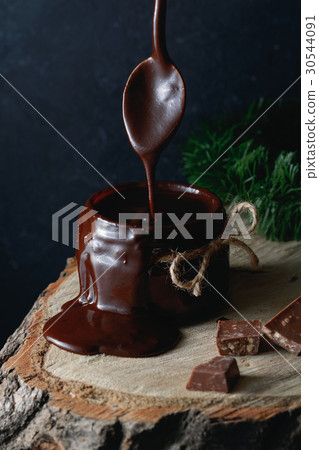 Homemade dark hot chocolate in a glass jar with Homemade dark hot chocolate in a glass jar with 30544091