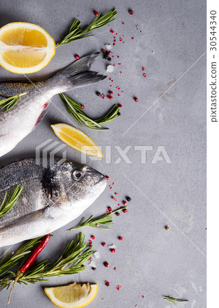 Raw fish cooking and ingredients. 30544340