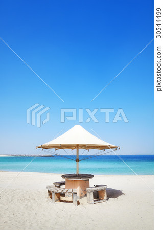Sun umbrella on a beach, summer holidays concept Sun umbrella on a beach, summer holidays concept 30544499