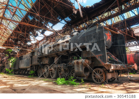 Old industrial locomotive in the garage Old industrial locomotive in the garage 30545188
