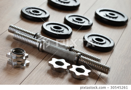 Dumbbells for weightlifting sessions. 30545261