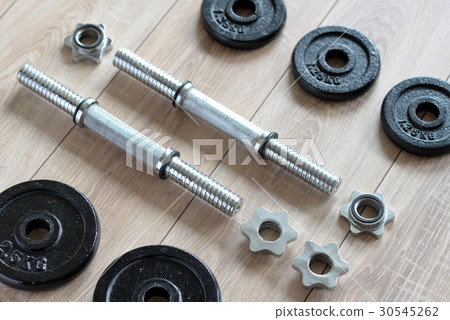 Dumbbells for weightlifting sessions. 30545262