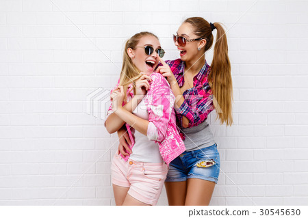 Two friends posing. modern lifestyle.two stylish Two friends posing. modern lifestyle.two stylish 30545630