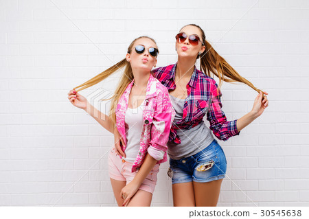 Fashion portrait of two friends posing. modern Fashion portrait of two friends posing. modern 30545638