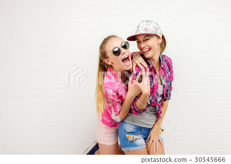 Two friends posing. modern lifestyle. two stylish Two friends posing. modern lifestyle. two stylish 30545666