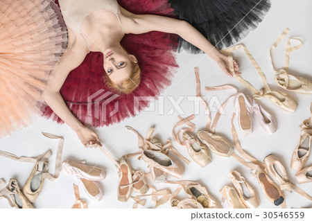 Blonde ballerina lies in studio 30546559
