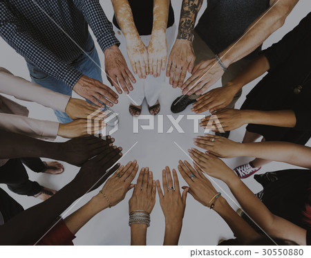Group of hands assemble in aerial view 30550880