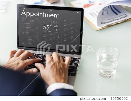 Business people checking appointment on personal organizer schedule Business people checking appointment on personal organizer schedule 30550992