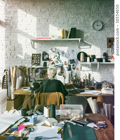 Fashion designer working on her workspace 30554650