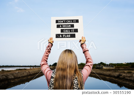 Young Woman Hands Holding Blank Paper with Life Motivation Phrase 30555190