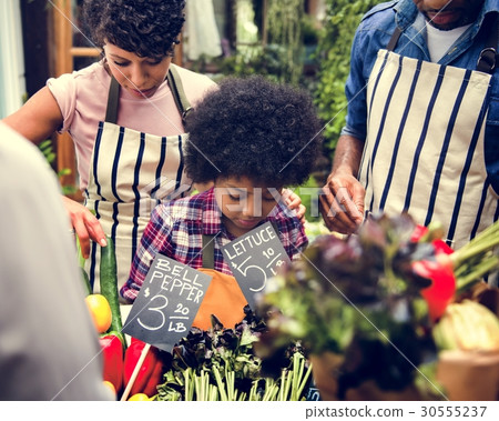 African family at organnic grocery shop 30555237