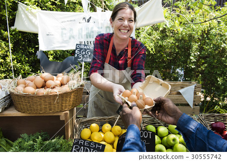 Greengrocer selling organic fresh agricultural product at farmer market Greengrocer selling organic fresh agricultural product at farmer market 30555742