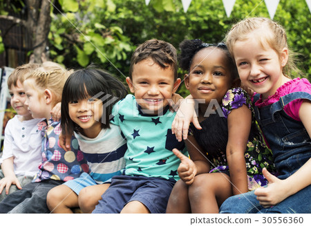 Group of kindergarten kids friends arm around sitting and smiling fun Group of kindergarten kids friends arm around sitting and smiling fun 30556360