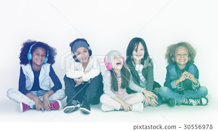 Group of Children Studio Smiling Wearing Headphones and Winter Clothes 30556978