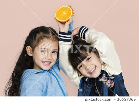 Two girls and fresh orange Two girls and fresh orange 30557369