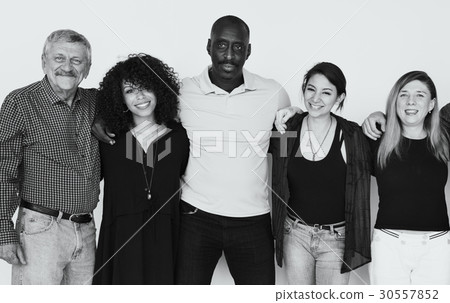 Group of people huddle and smiling together Group of people huddle and smiling together 30557852