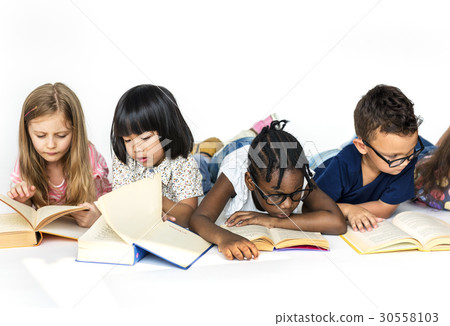 Group of cute and adorable children lay down wtih textbook 30558103