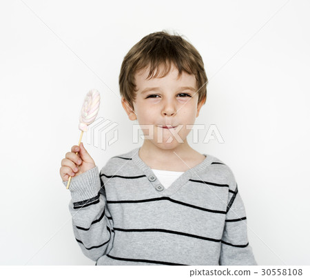 Happiness little boy smiling with lollipop studio portrait Happiness little boy smiling with lollipop studio portrait 30558108