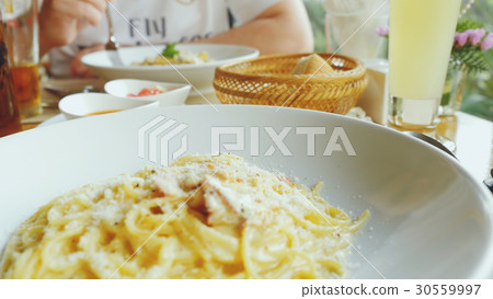 steaming plate of spaghetti in the restaurant steaming plate of spaghetti in the restaurant 30559997