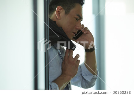 the businessman is making a phone call. the businessman is making a phone call. 30560288