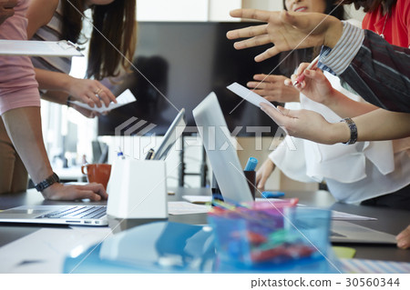 hands are holding documents. hands are holding documents. 30560344