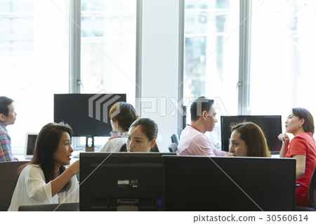 Colleagues are talking and discussing in office. Colleagues are talking and discussing in office. 30560614