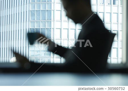 a blurry photo of a man who is sitting a blurry photo of a man who is sitting 30560732