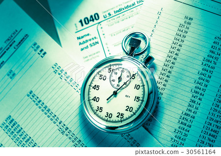 Tax form, operating budget and stopwatch Tax form, operating budget and stopwatch 30561164