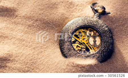 Clockwork inside mechanism in sand Clockwork inside mechanism in sand 30561526