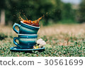Two blue ceramic cups with a splash 30561699