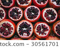 Rows sliced pomegranate on the market 30561701