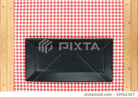 dish on checkered tablecloth dish on checkered tablecloth 30562367