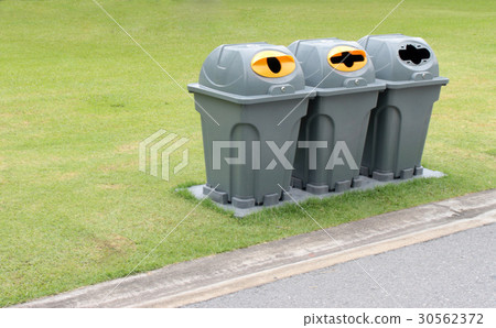 Trash bins at outdoor park 30562372