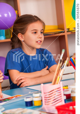 Small students girl painting in art school class. Small students girl painting in art school class. 30563870