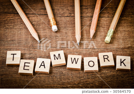 TEAMWORK word written on wood block with pencils. TEAMWORK word written on wood block with pencils. 30564570