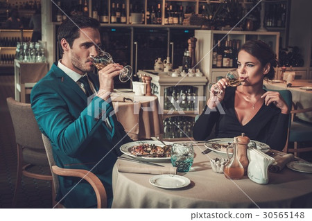 Stylish couple in a restaurant Stylish couple in a restaurant 30565148