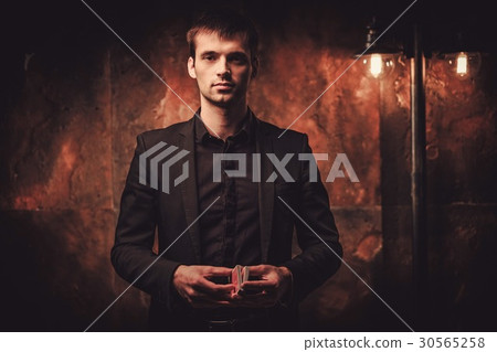 Man showing tricks with cards Man showing tricks with cards 30565258