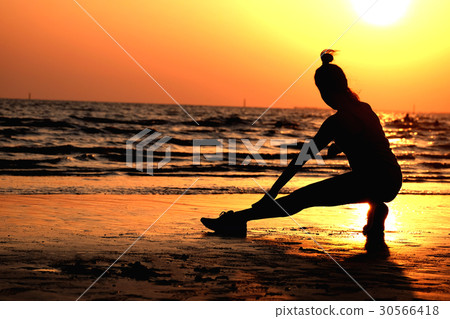 Silhouette .athletic woman warm up a workout Silhouette .athletic woman warm up a workout 30566418