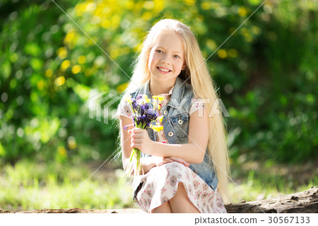 Little blonde girl with bouquet of flowers Little blonde girl with bouquet of flowers 30567133