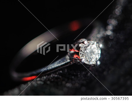 diamond ring on a black background diamond ring on a black background 30567395