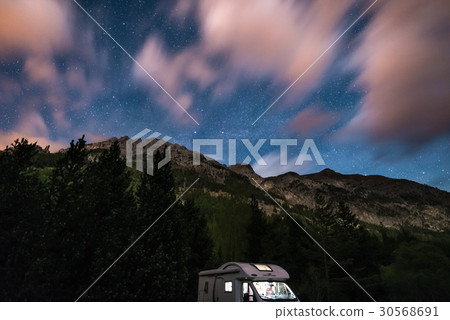 Camper van under moonlight, starry sky Camper van under moonlight, starry sky 30568691