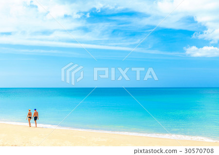 Romantic Couple Walking On Tropical Beach 30570708