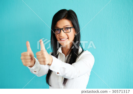 Woman gesturing ok with thumbs up 30571317