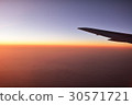 The world above the clouds seen from the plane Evening sunset 30571721