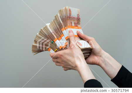 Hand with russian roubles bills  on whit 30571794
